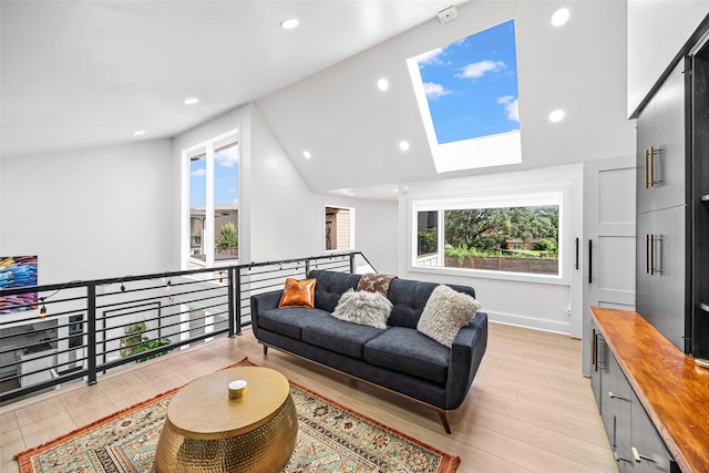 5122 Glenmeadow Dr, Houston, TX 77096 - living room with light wood-style flooring, a skylight, vaulted ceiling, and recessed lighting