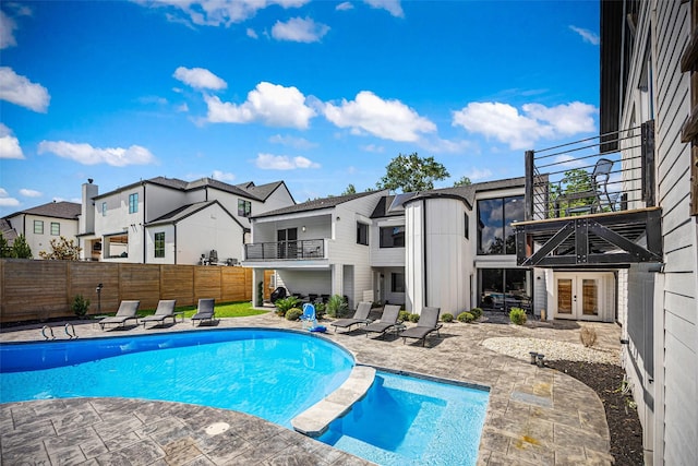 5122 Glenmeadow Dr, Houston, TX 77096 - view of swimming pool with french doors, a fenced backyard, a patio area, a residential view, and a pool with connected hot tub