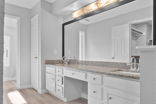 668 N Eldridge Pkwy, Houston, TX 77079 - full bathroom with double vanity, a stall shower, and wood finish floors