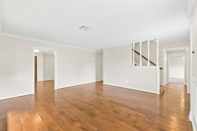 17931 Loring Ln, Spring, TX 77388 - spare room featuring wood finished floors, crown molding, and stairway