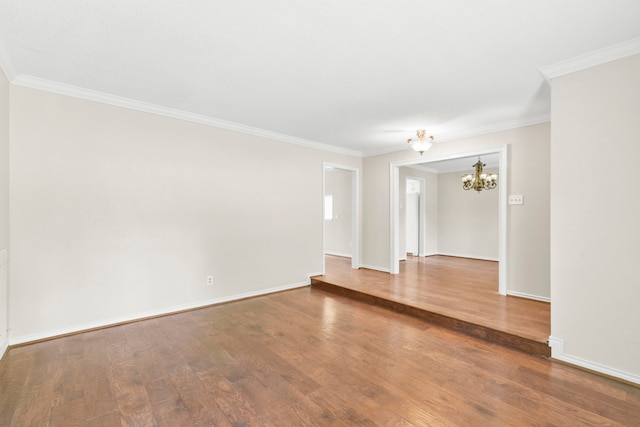 17931 Loring Ln, Spring, TX 77388 - spare room featuring a chandelier, wood finished floors, and crown molding