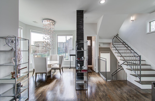 427 Tuam St Unit B, Houston, TX 77006 - dining space featuring wood finished floors, stairway, and a chandelier