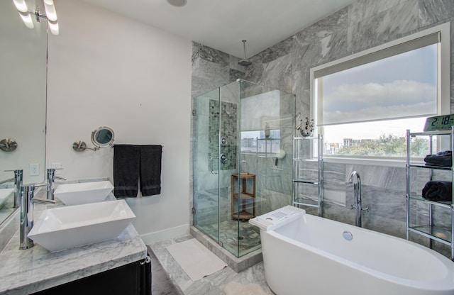 427 Tuam St Unit B, Houston, TX 77006 - full bath with double vanity, a shower stall, a freestanding tub, and marble finish floors