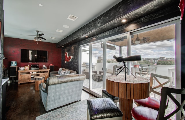 427 Tuam St Unit B, Houston, TX 77006 - living room featuring wallpapered walls, ceiling fan, and wood finished floors