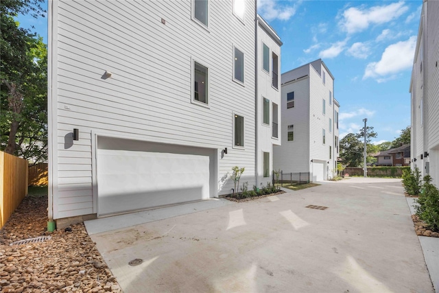 4415 Caroline St, Houston, TX 77004 - view of home's exterior with an attached garage