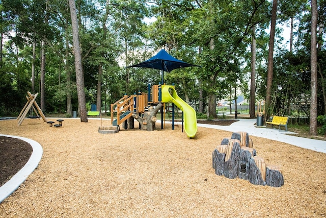 1168 Beals Creek St, Conroe, TX 77304 - community jungle gym featuring view of scattered trees