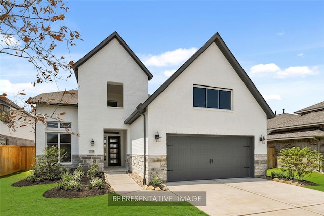 1168 Beals Creek St, Conroe, TX 77304 - view of front of house with an attached garage, stone siding, and concrete driveway