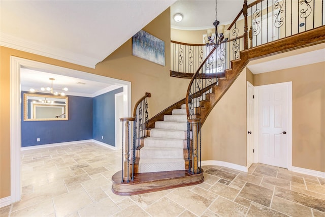 5307 Boyce Springs Dr, Houston, TX 77066 - staircase with a chandelier, stone tile flooring, ornamental molding, and a towering ceiling