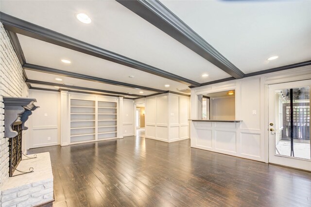 5307 Boyce Springs Dr, Houston, TX 77066 - unfurnished living room featuring ornamental molding, a decorative wall, wood-type flooring, beamed ceiling, and recessed lighting