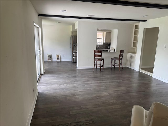 8446 Cabot St, Houston, TX 77078 - living area with dark wood-type flooring and baseboards