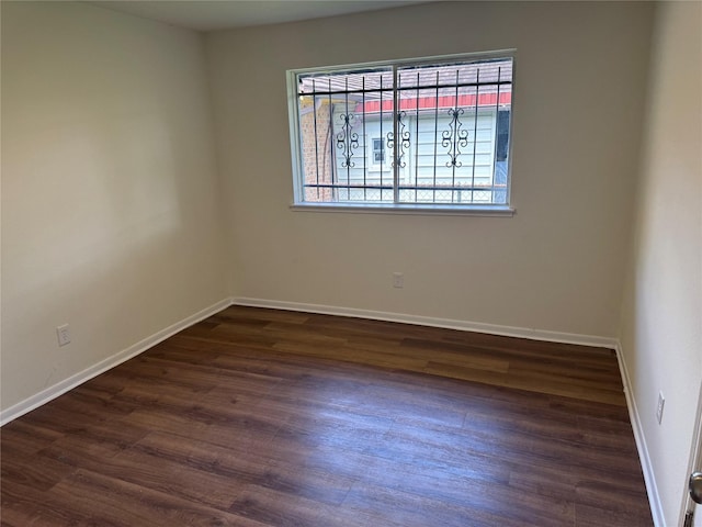 8446 Cabot St, Houston, TX 77078 - unfurnished room featuring dark wood-style flooring and baseboards
