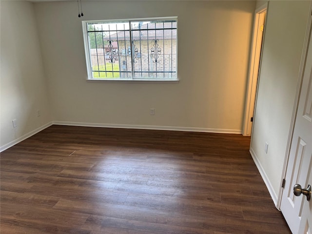 8446 Cabot St, Houston, TX 77078 - empty room with dark wood-type flooring and baseboards