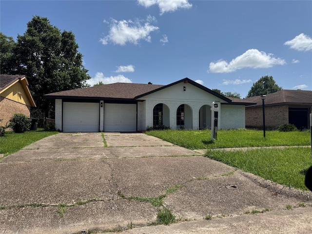 8446 Cabot St, Houston, TX 77078 - view of front of house featuring a garage and concrete driveway