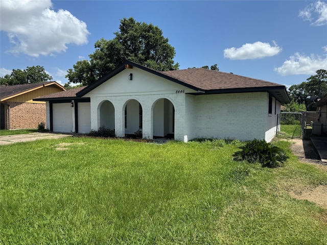 8446 Cabot St, Houston, TX 77078 - view of front of house featuring brick siding, a garage, roof with shingles, a gate, and concrete driveway
