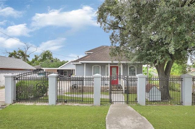 1802 Kowis St, Houston, TX 77093 - bungalow featuring a porch, a gate, a fenced front yard, and a shingled roof