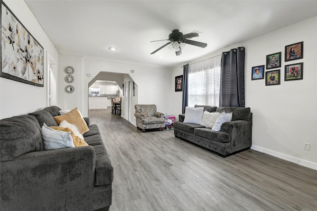 1802 Kowis St, Houston, TX 77093 - living area with arched walkways, ceiling fan, wood finished floors, recessed lighting, and crown molding