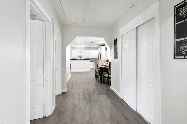 1802 Kowis St, Houston, TX 77093 - corridor featuring dark wood finished floors and attic access