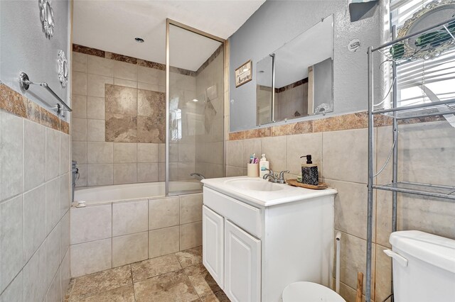 1802 Kowis St, Houston, TX 77093 - bathroom featuring tile walls, vanity, and tiled shower / bath