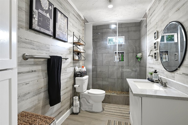 1802 Kowis St, Houston, TX 77093 - full bath with vanity, a stall shower, wood finished floors, and a textured ceiling
