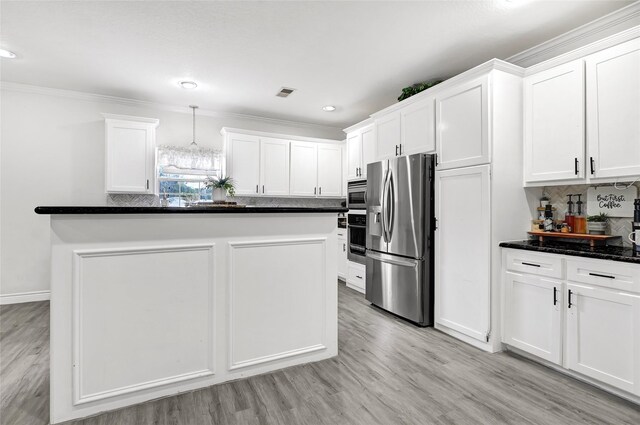 1802 Kowis St, Houston, TX 77093 - kitchen featuring stainless steel appliances, white cabinetry, crown molding, backsplash, and light wood finished floors