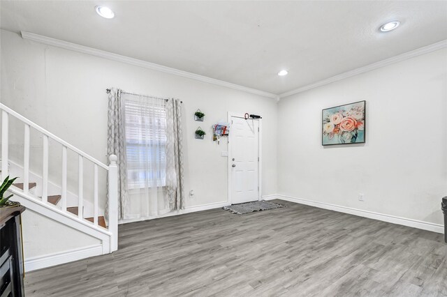 1802 Kowis St, Houston, TX 77093 - foyer with stairs, ornamental molding, wood finished floors, and recessed lighting