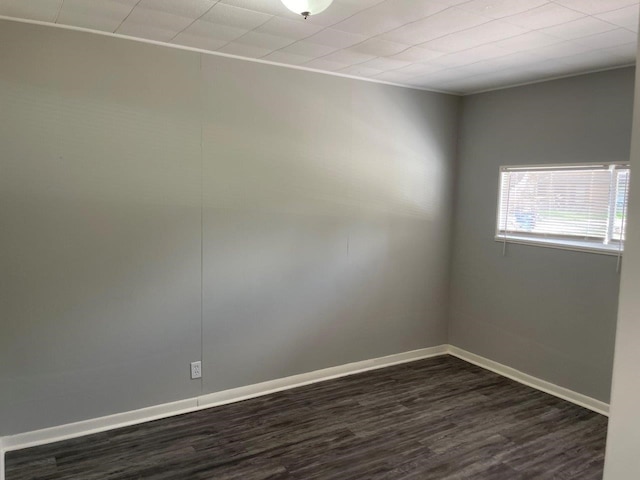 905 N Arcola St, Angleton, TX 77515 - empty room featuring dark wood-style floors and baseboards