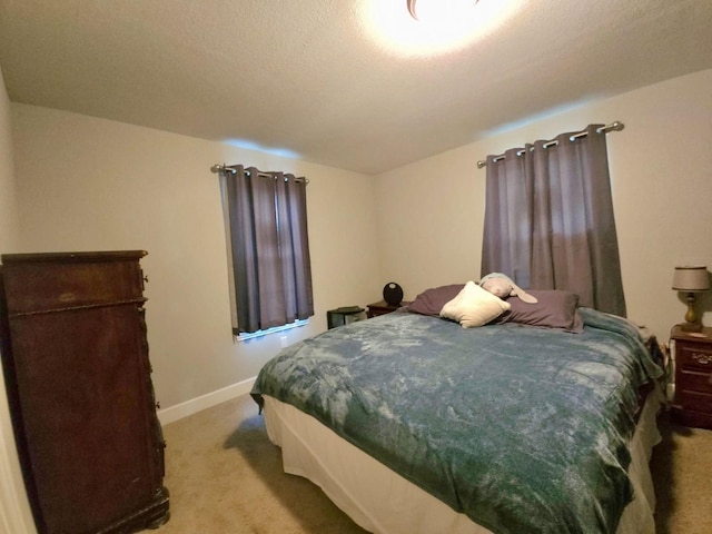 6227 Cavalier St Unit 770, Houston, TX 77087 - bedroom featuring light carpet and baseboards