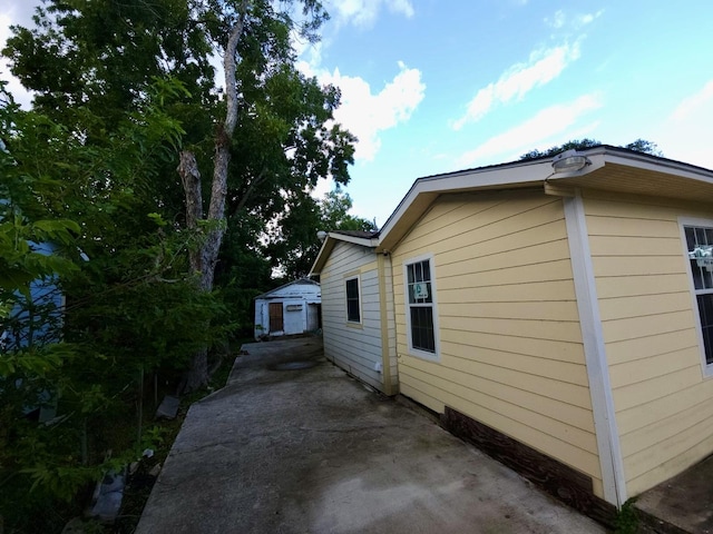 6227 Cavalier St Unit 770, Houston, TX 77087 - view of property exterior featuring an outbuilding and a patio area