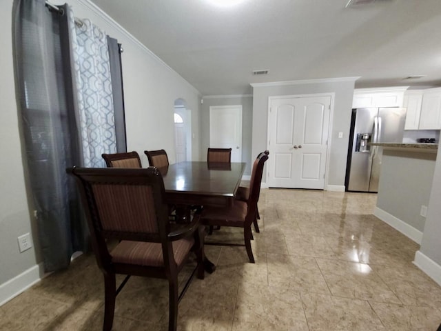 6227 Cavalier St Unit 770, Houston, TX 77087 - dining space featuring ornamental molding and arched walkways
