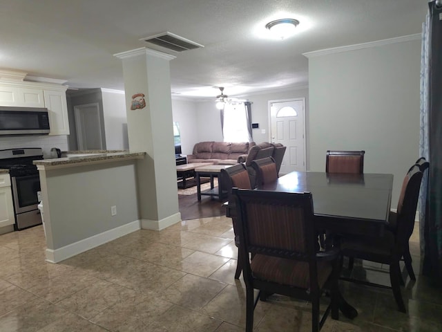 6227 Cavalier St Unit 770, Houston, TX 77087 - dining room with crown molding, a ceiling fan, and light tile patterned floors
