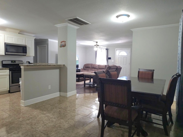 6227 Cavalier St Unit 770, Houston, TX 77087 - dining area with crown molding and a ceiling fan