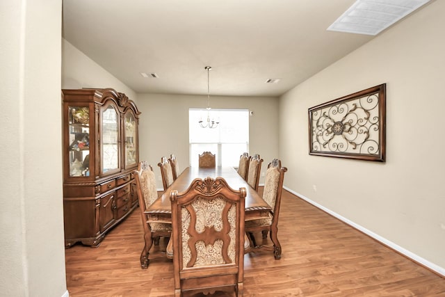 3811 Rosalind Ln, Houston, TX 77053 - dining area featuring a chandelier and light wood-type flooring