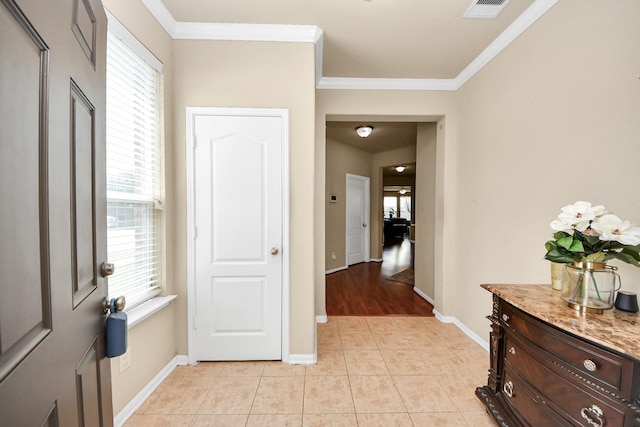 3811 Rosalind Ln, Houston, TX 77053 - hall featuring light tile patterned floors, plenty of natural light, and ornamental molding