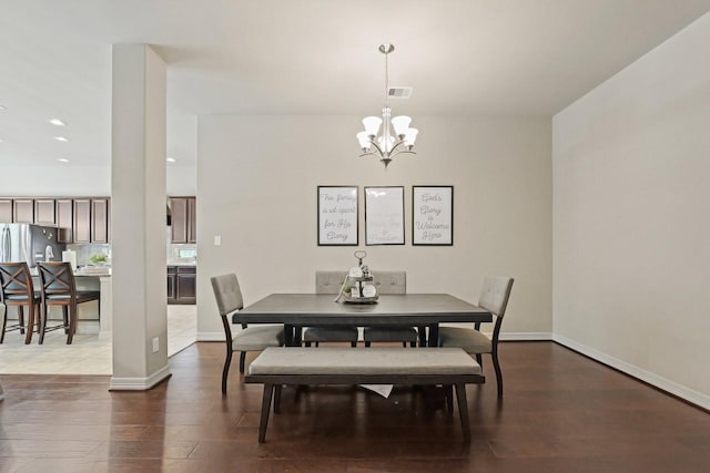 166 Hearthshire Cir, Magnolia, TX 77354 - dining room with a chandelier, dark wood-type flooring, and recessed lighting