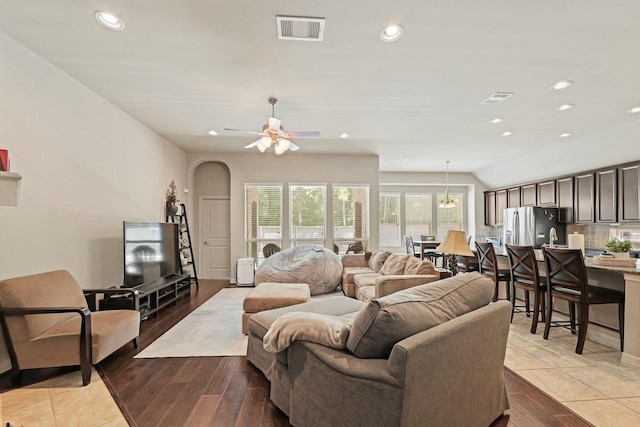 166 Hearthshire Cir, Magnolia, TX 77354 - living room with recessed lighting, arched walkways, ceiling fan, and light wood-style flooring