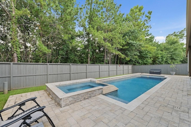 166 Hearthshire Cir, Magnolia, TX 77354 - view of swimming pool featuring a patio, a pool with connected hot tub, and a fenced backyard