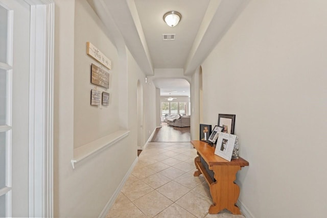 166 Hearthshire Cir, Magnolia, TX 77354 - hall featuring light tile patterned floors and arched walkways