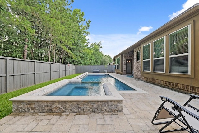 166 Hearthshire Cir, Magnolia, TX 77354 - view of pool with a fenced backyard, a patio area, and a pool with connected hot tub