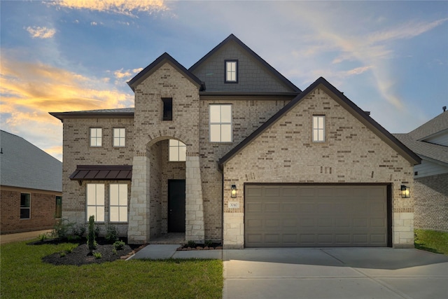 3040 Mesquite Pod Trl, Conroe, TX 77301 - view of front facade featuring concrete driveway, a garage, brick siding, and a yard