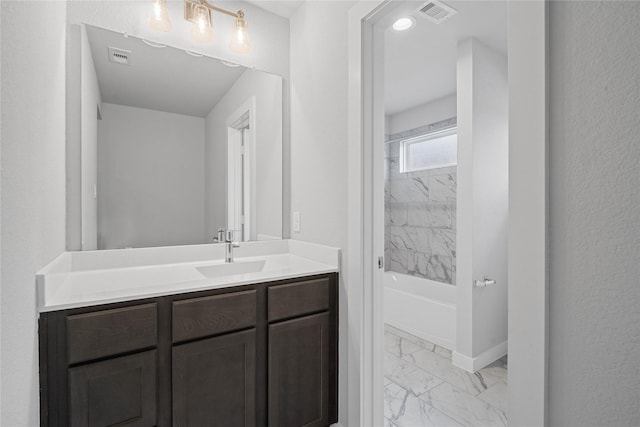 3040 Mesquite Pod Trl, Conroe, TX 77301 - full bath featuring marble look tile flooring, vanity, and shower / washtub combination