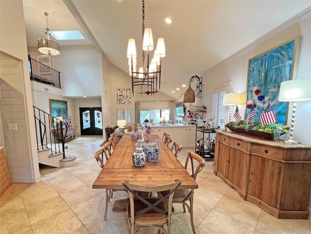 1234 Challenger, Lakeway, TX 78734 - dining area with stairs, light tile patterned flooring, a skylight, a chandelier, and high vaulted ceiling