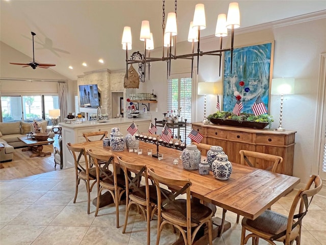 1234 Challenger, Lakeway, TX 78734 - dining room with light tile patterned flooring, healthy amount of natural light, a ceiling fan, lofted ceiling, and crown molding