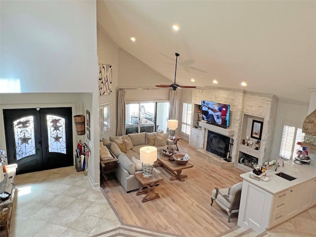 1234 Challenger, Lakeway, TX 78734 - living room with high vaulted ceiling, a ceiling fan, a fireplace, french doors, and recessed lighting