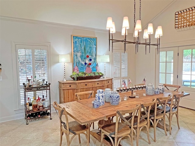 1234 Challenger, Lakeway, TX 78734 - dining room featuring light tile patterned floors, a chandelier, and ornamental molding