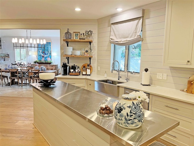 1234 Challenger, Lakeway, TX 78734 - kitchen with stainless steel countertops, light wood-style floors, healthy amount of natural light, a chandelier, and recessed lighting