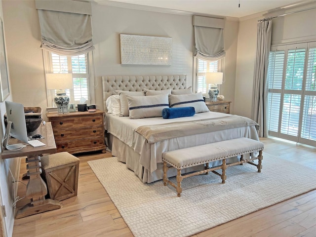 1234 Challenger, Lakeway, TX 78734 - bedroom with light wood-type flooring, multiple windows, ornamental molding, and access to outside