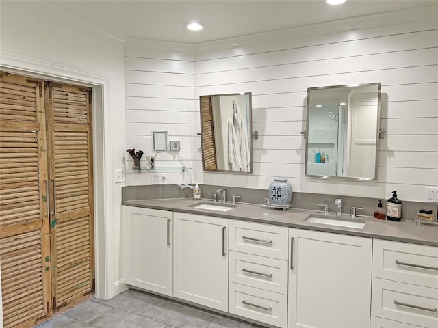 1234 Challenger, Lakeway, TX 78734 - full bath featuring crown molding, double vanity, tile patterned flooring, and wooden walls