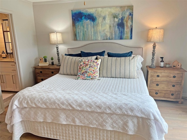 1234 Challenger, Lakeway, TX 78734 - bedroom with wood finished floors, crown molding, and ensuite bathroom