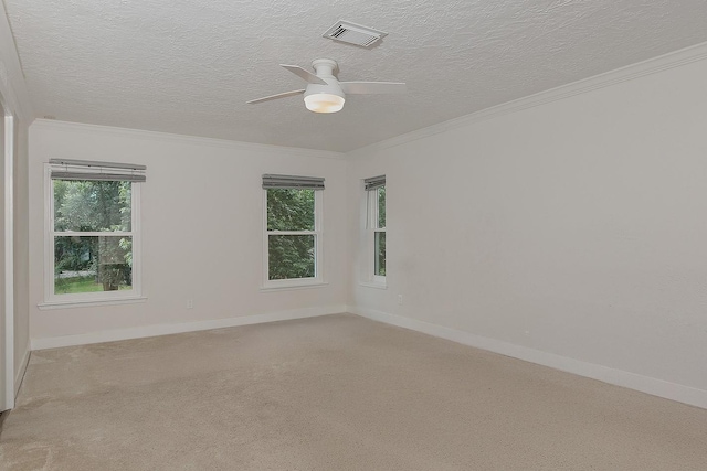 3 Meadow Beauty, The Woodlands, TX 77381 - unfurnished room featuring a ceiling fan, a textured ceiling, ornamental molding, and light colored carpet