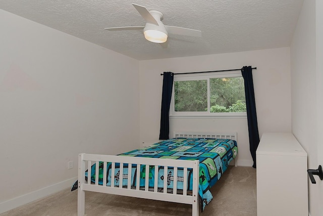 3 Meadow Beauty, The Woodlands, TX 77381 - carpeted bedroom with a textured ceiling and a ceiling fan